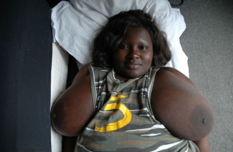 Fat black woman Mariana Kodjo showing off her extra-large natural tits