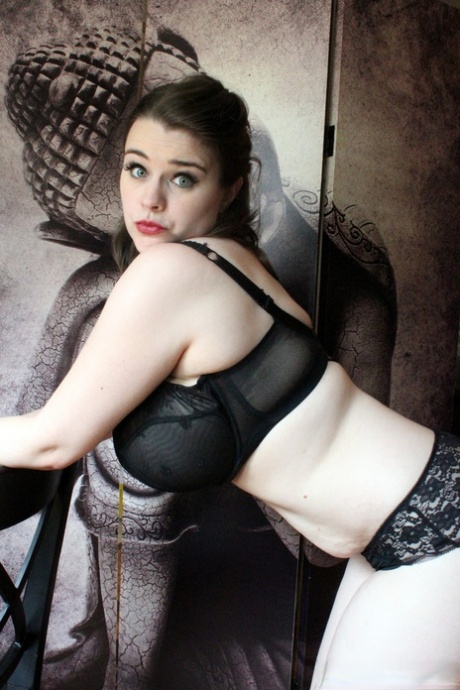 Comely brunette Tiggle Bitties teases with her big boobs in black lingerie