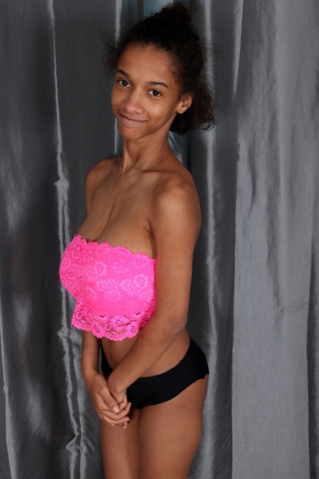 Ebony Addisson shows off her huge breasts and squeezes them in undies