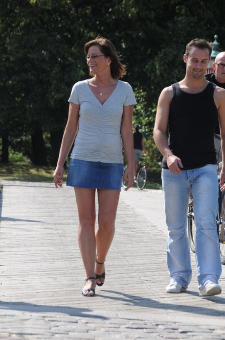 European mature with small tits Lilje gets fucked by two guys in the park