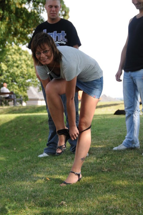 European mature with small tits Lilje gets fucked by two guys in the park