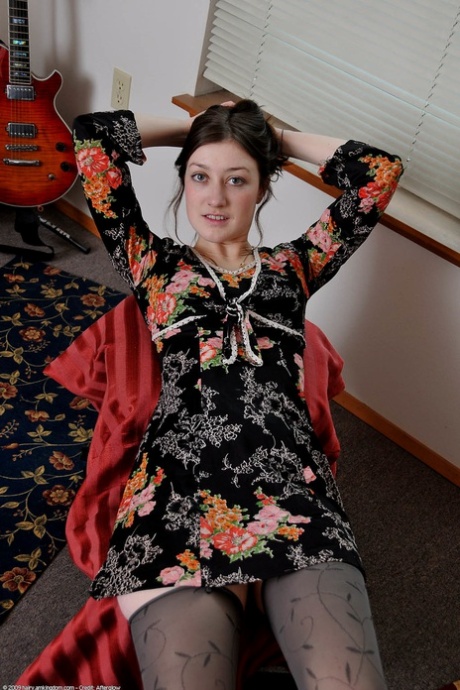 Brunette teen Wendy undressing and spreading her hairy pussy in a solo