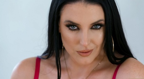 Stunning MILF Angela White pleasures a big dick with her lubed big tits