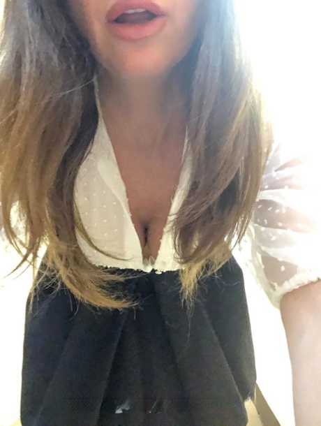 Hot MILF Lara shows her big boobs while trying on various sexy lingerie sets