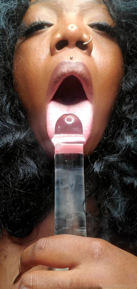 Ebony fatty with big saggy tits Chy Latte sucking and licking a glass toy