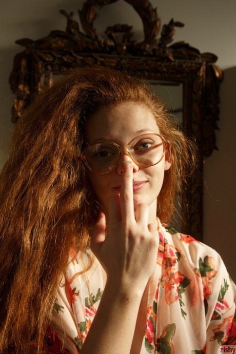 Petite redhead Wendy Patton strips fully naked and takes a bubble bath