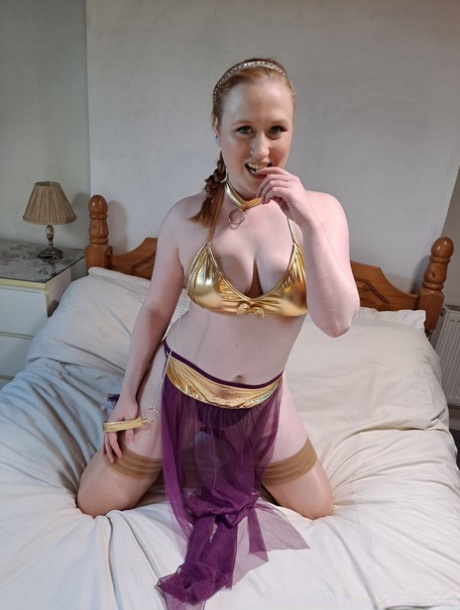 British babe Satine Spark exposes her natural tits & her shaved pussy