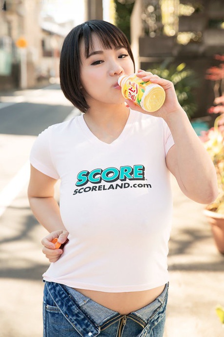 Asian hottie Kaho Shibuya reveals her huge bosom and poses nude on a desk