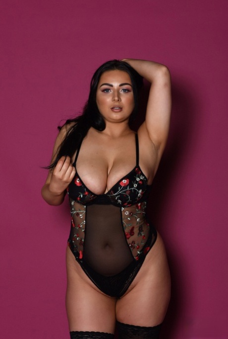 Chubby babe Foxy Lucina exposes her fabulous juggs while posing in stockings