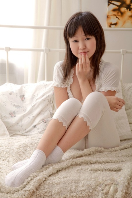 Tiny Japanese teen Aliona strips to her cute socks and touches her muff