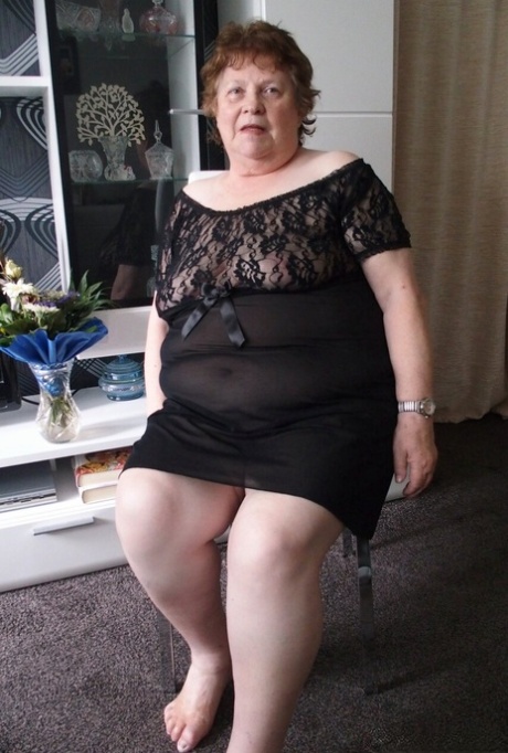 Naughty chubby granny Hortensia plays with her big tits while undressing