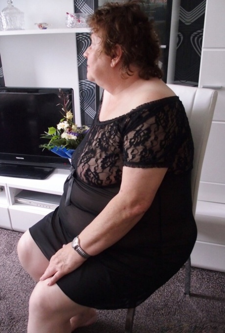 Naughty chubby granny Hortensia plays with her big tits while undressing