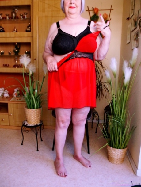 Cute granny with red lipstick Melichora unveils her big saggy tits & flat ass