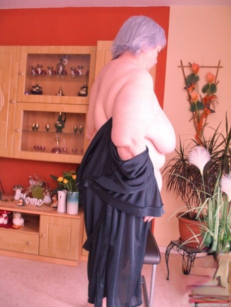 Gorgeous granny Melichora exposing her huge flat ass and big saggy tits