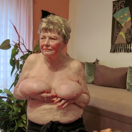 Shy granny Phyladelphia playing with her huge saggy tits in a solo