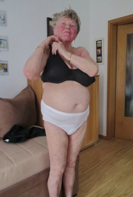 Shy granny Phyladelphia playing with her huge saggy tits in a solo
